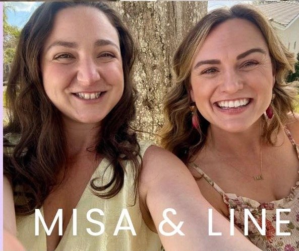 Misa and Line, the two owners of Bubbly Balloons, smiling together outdoors